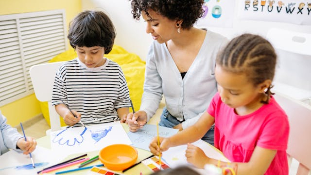 a teacher and a couple of learners
